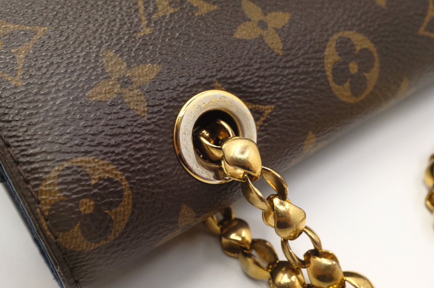 Louis Vuitton Victoire in Monogram Canvas & Blue Leather