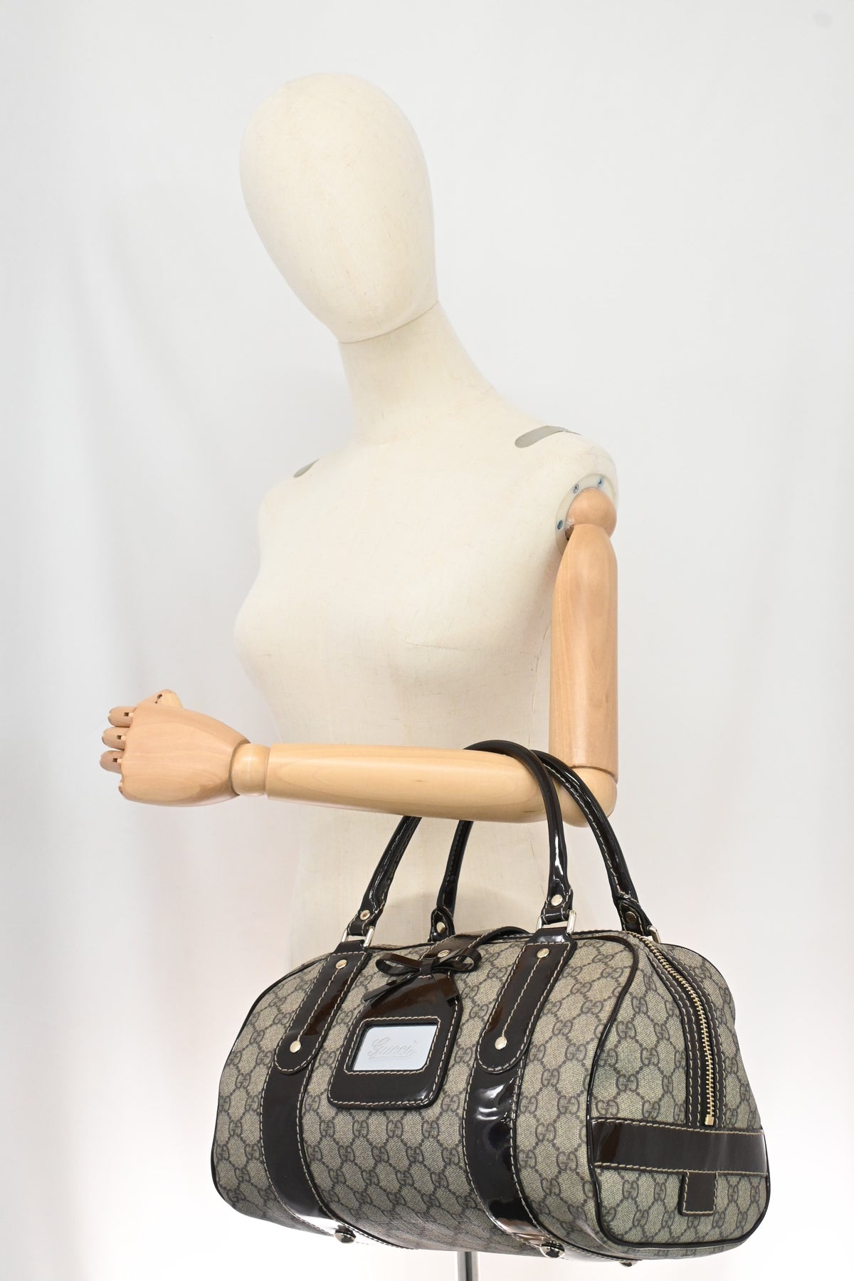 Gucci Boston Bag in GG Supreme Canvas and Brown Patent Leather