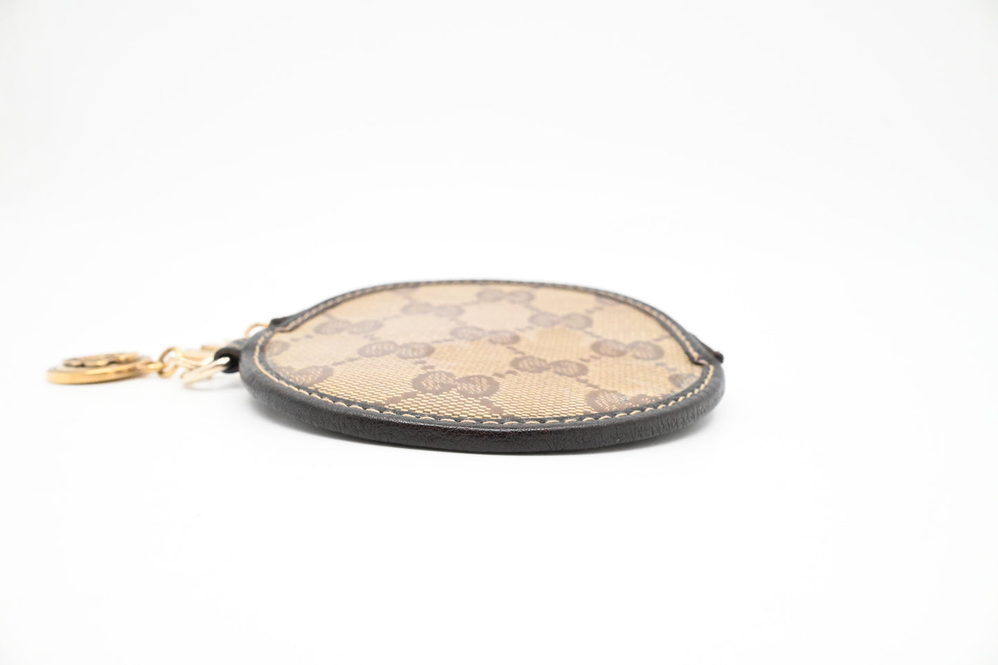 Gucci Round Coin Case in GG Coated Canvas