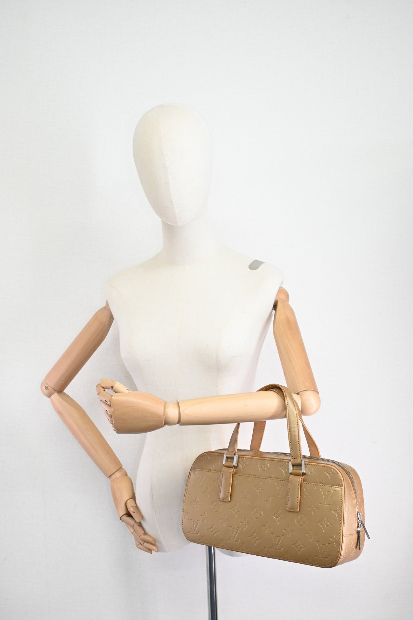 Louis Vuitton Shelton in Gold Matte Monogram Leather