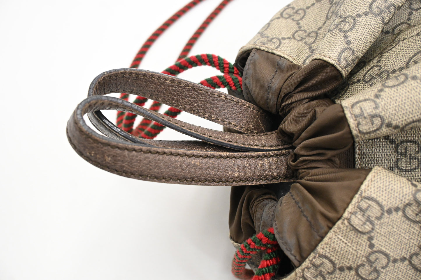 Gucci Tiger Drawstring Backpack in GG Supreme Canvas