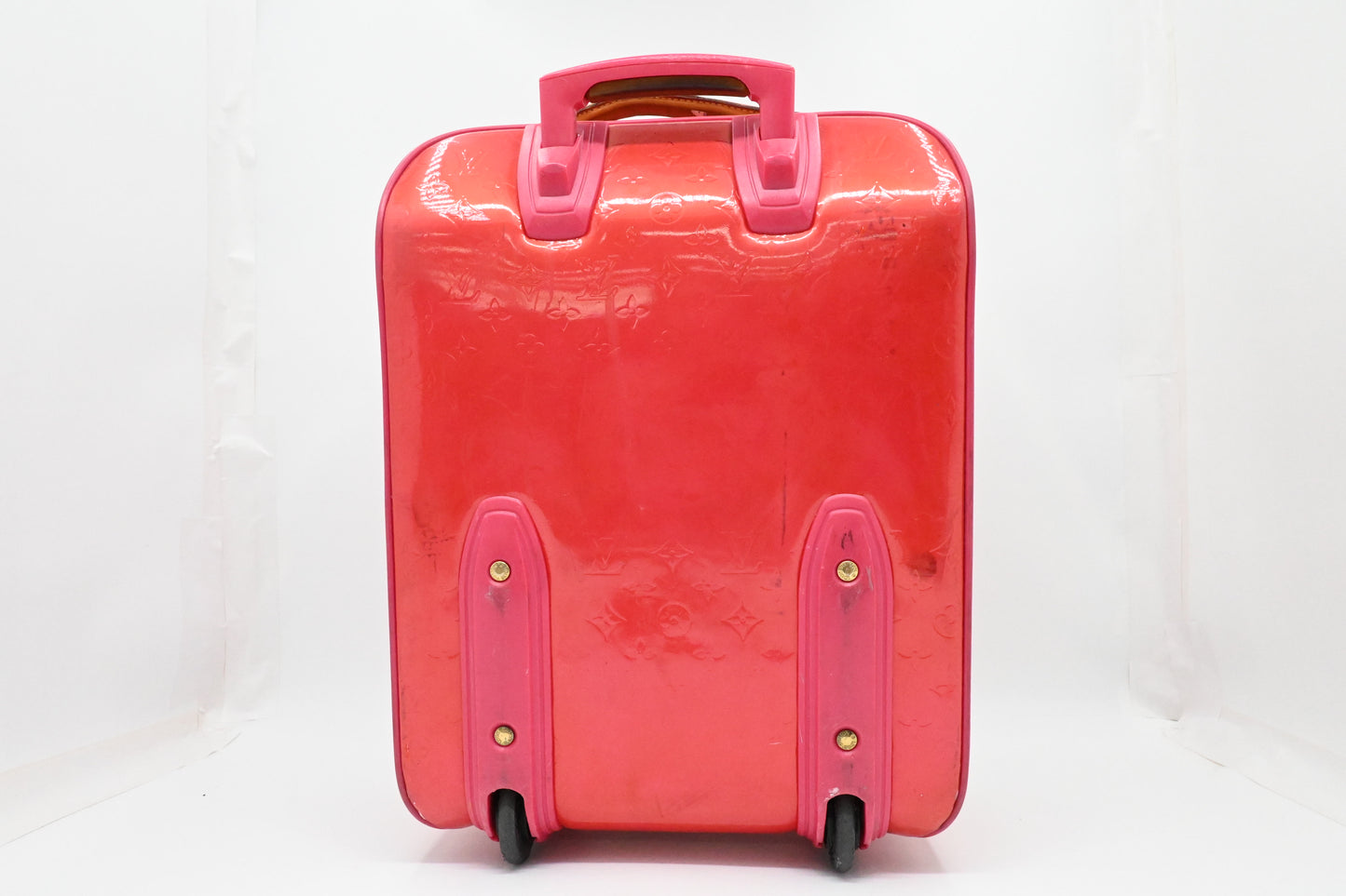 Louis Vuitton Pegase 45 in Grapefruit Vernis Leather