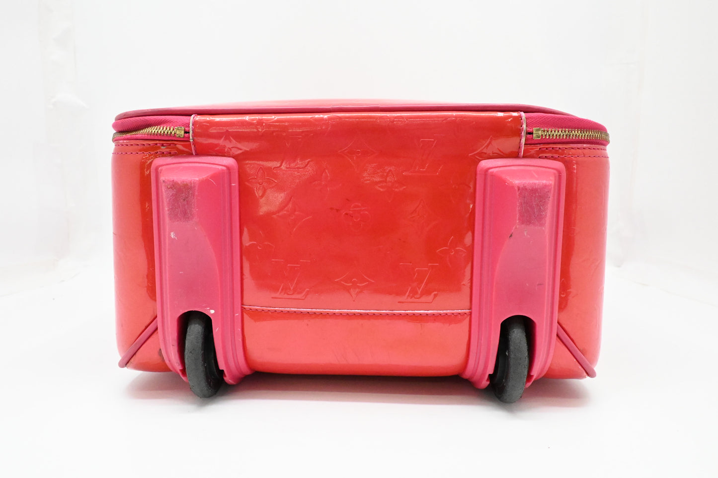 Louis Vuitton Pegase 45 in Grapefruit Vernis Leather