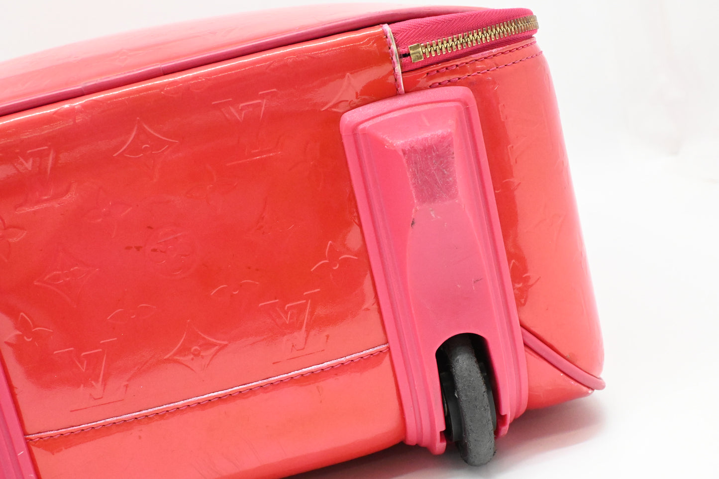 Louis Vuitton Pegase 45 in Grapefruit Vernis Leather