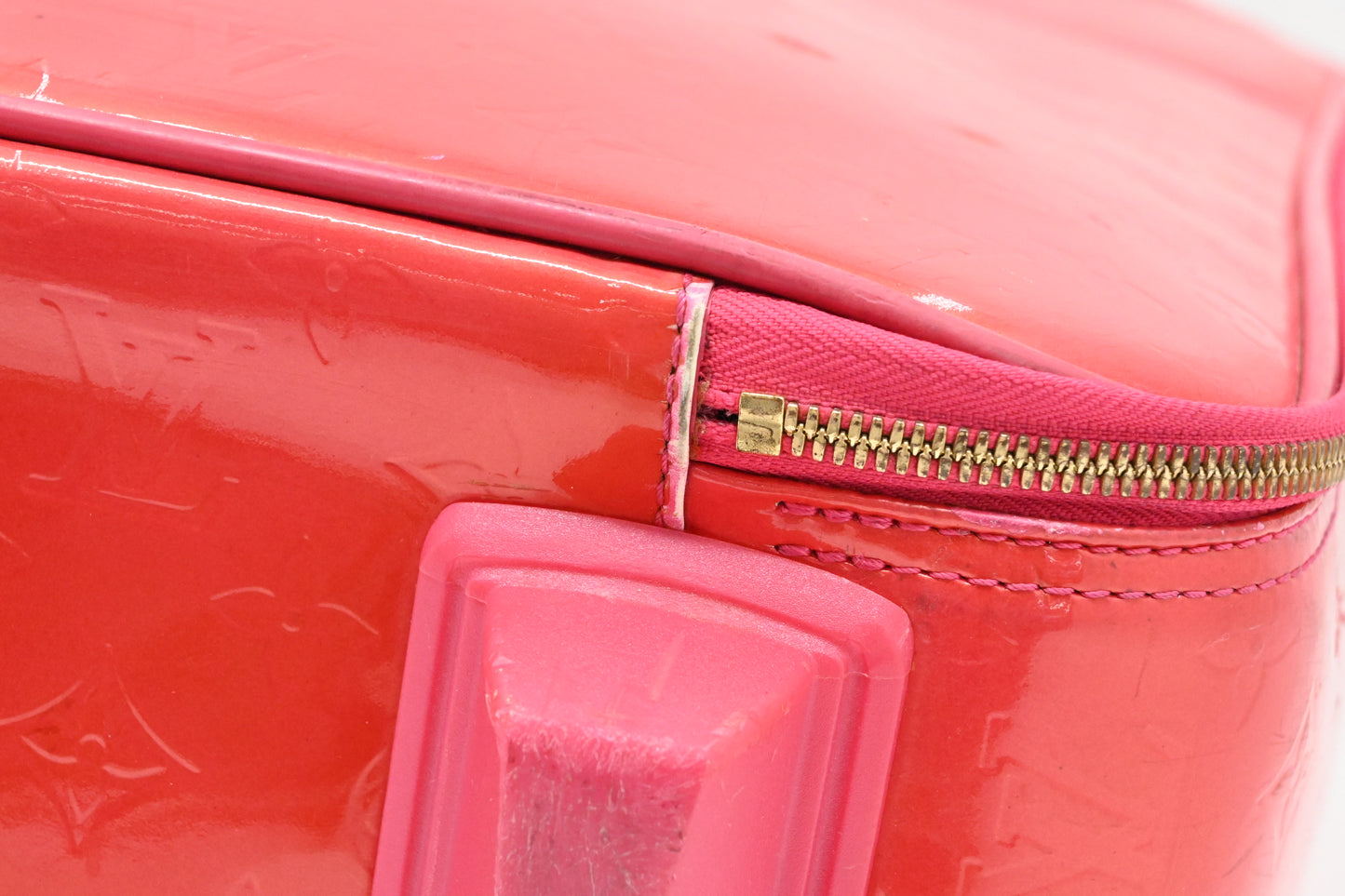 Louis Vuitton Pegase 45 in Grapefruit Vernis Leather