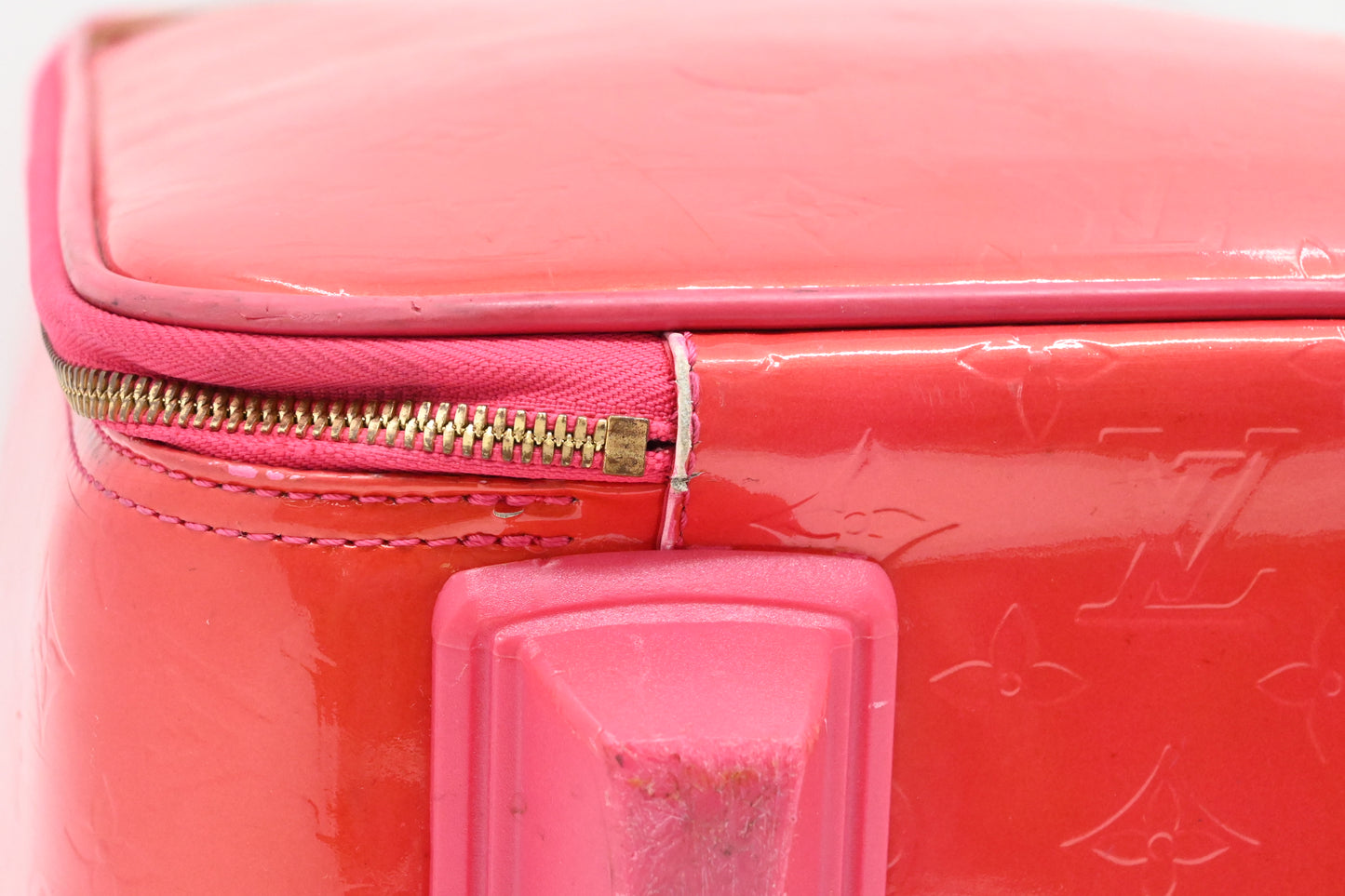 Louis Vuitton Pegase 45 in Grapefruit Vernis Leather