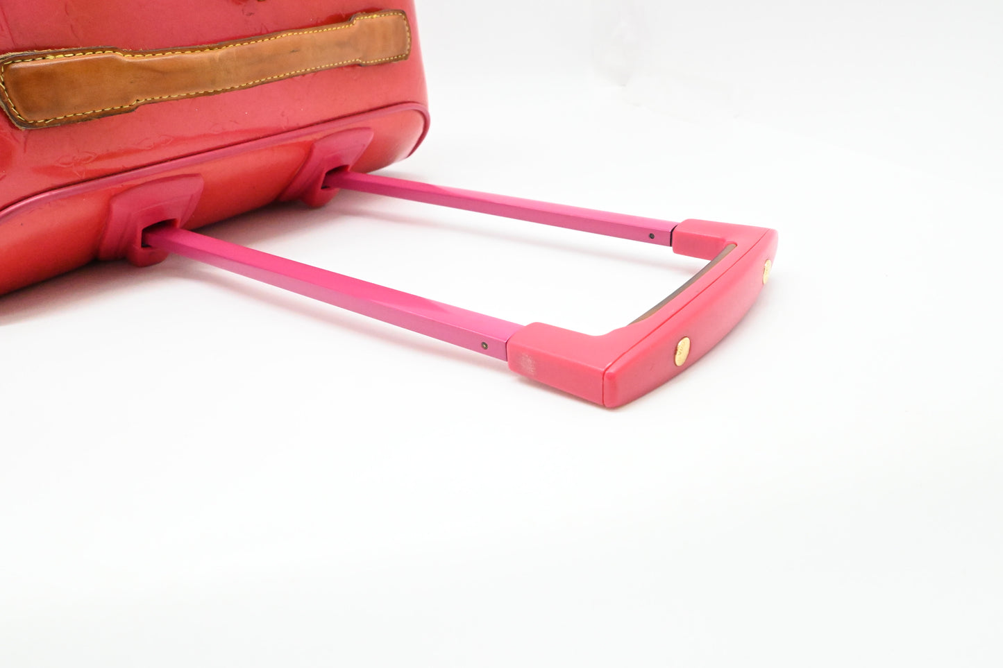 Louis Vuitton Pegase 45 in Grapefruit Vernis Leather