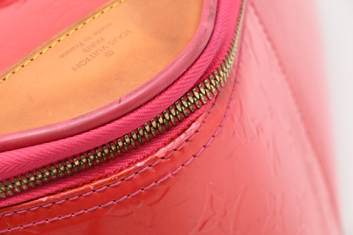 Louis Vuitton Pegase 45 in Grapefruit Vernis Leather