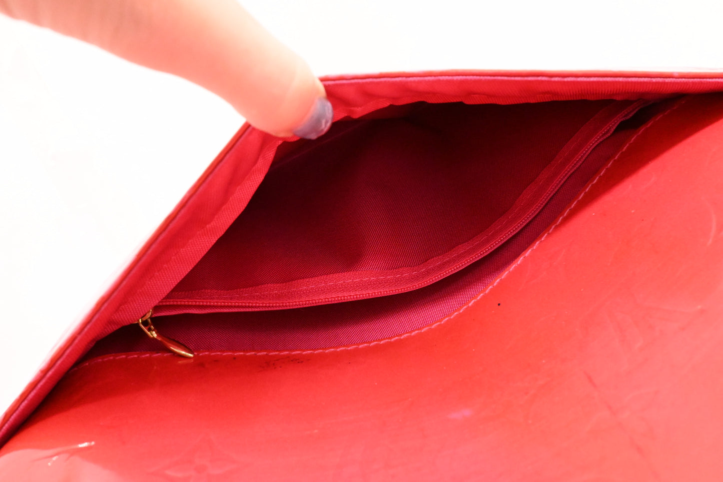 Louis Vuitton Pegase 45 in Grapefruit Vernis Leather