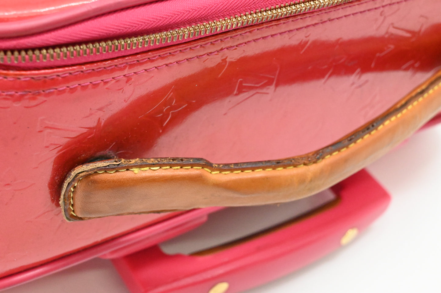 Louis Vuitton Pegase 45 in Grapefruit Vernis Leather