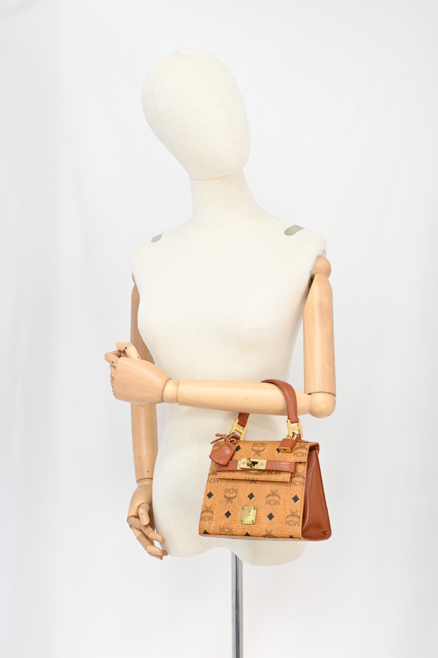 MCM Mini Kelly in Cognac Visetos Canvas