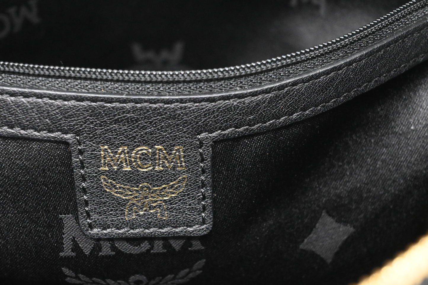 MCM Clutch in Black Faux Python Leather