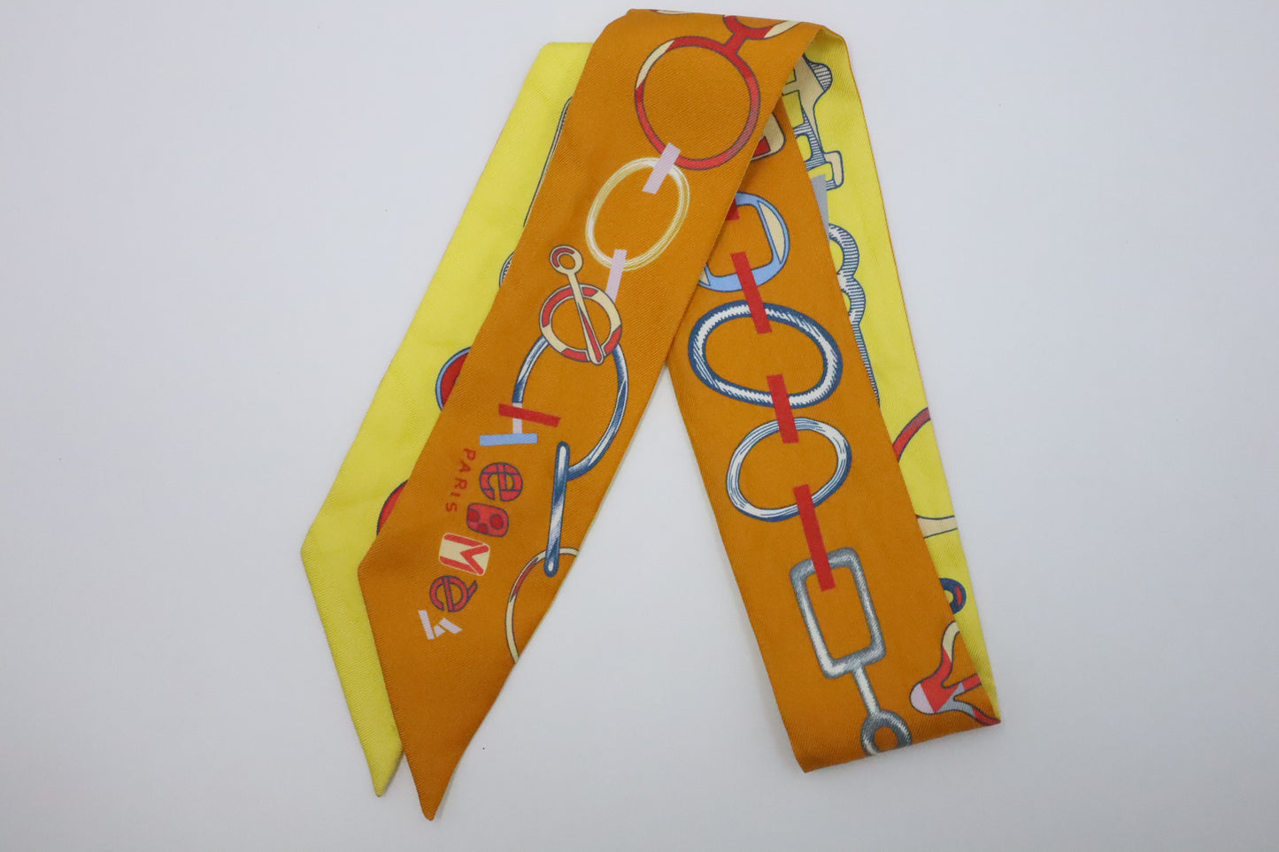 Hermes Twilly 'Do Re Boucles' in Orange & Yellow Silk