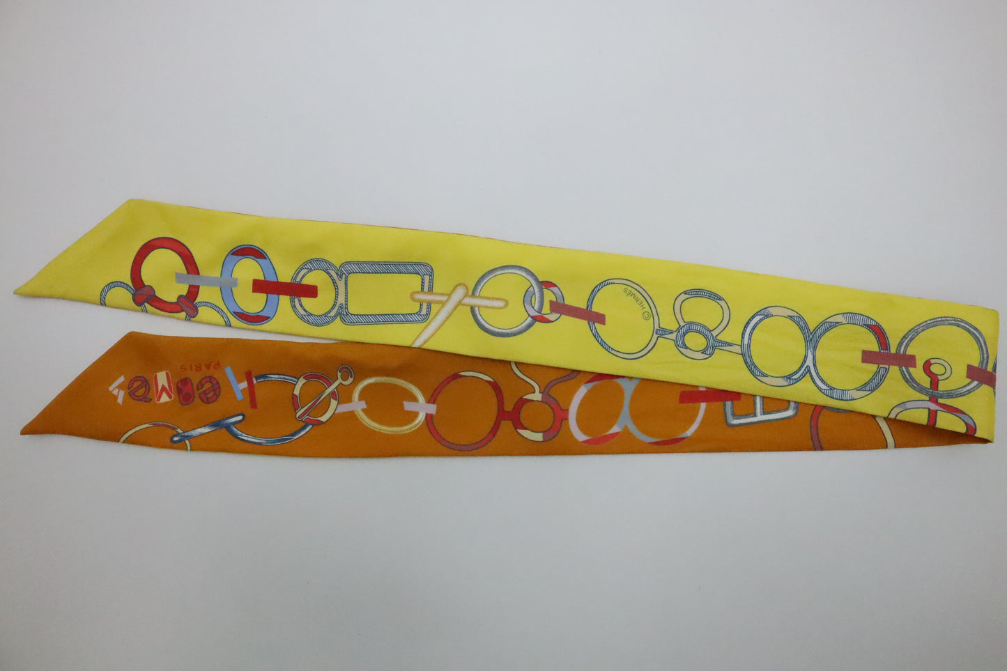 Hermes Twilly 'Do Re Boucles' in Orange & Yellow Silk