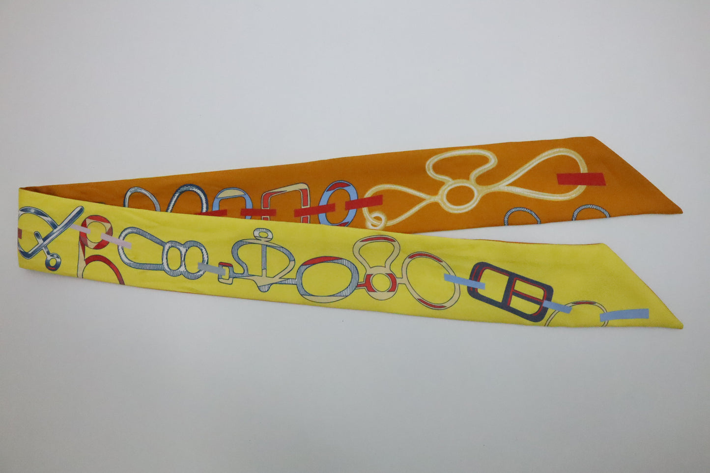 Hermes Twilly 'Do Re Boucles' in Orange & Yellow Silk
