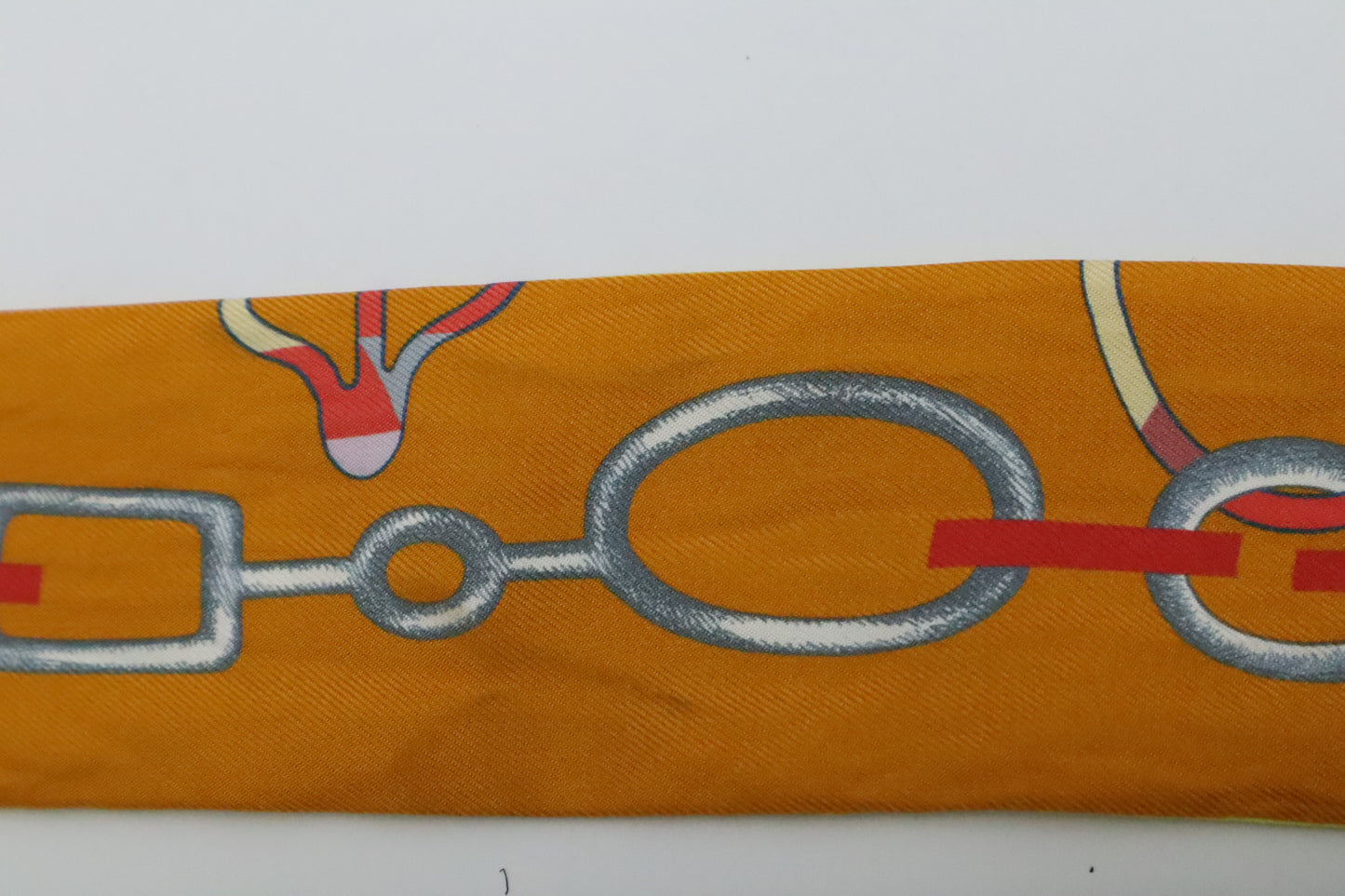 Hermes Twilly 'Do Re Boucles' in Orange & Yellow Silk