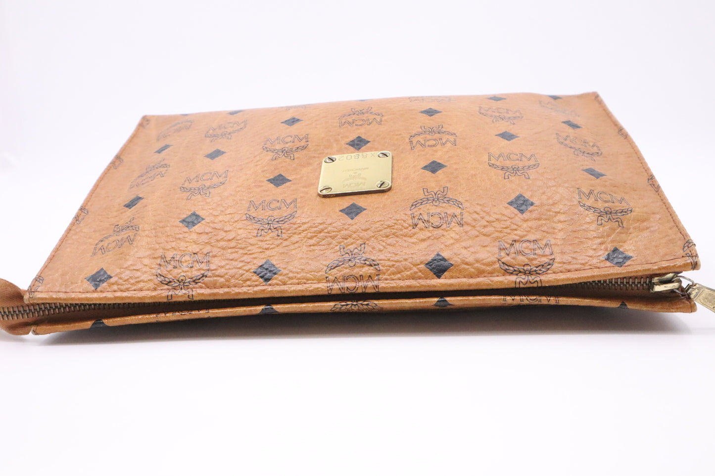 MCM Clutch Bag in Cognac Visetos Coated Canvas