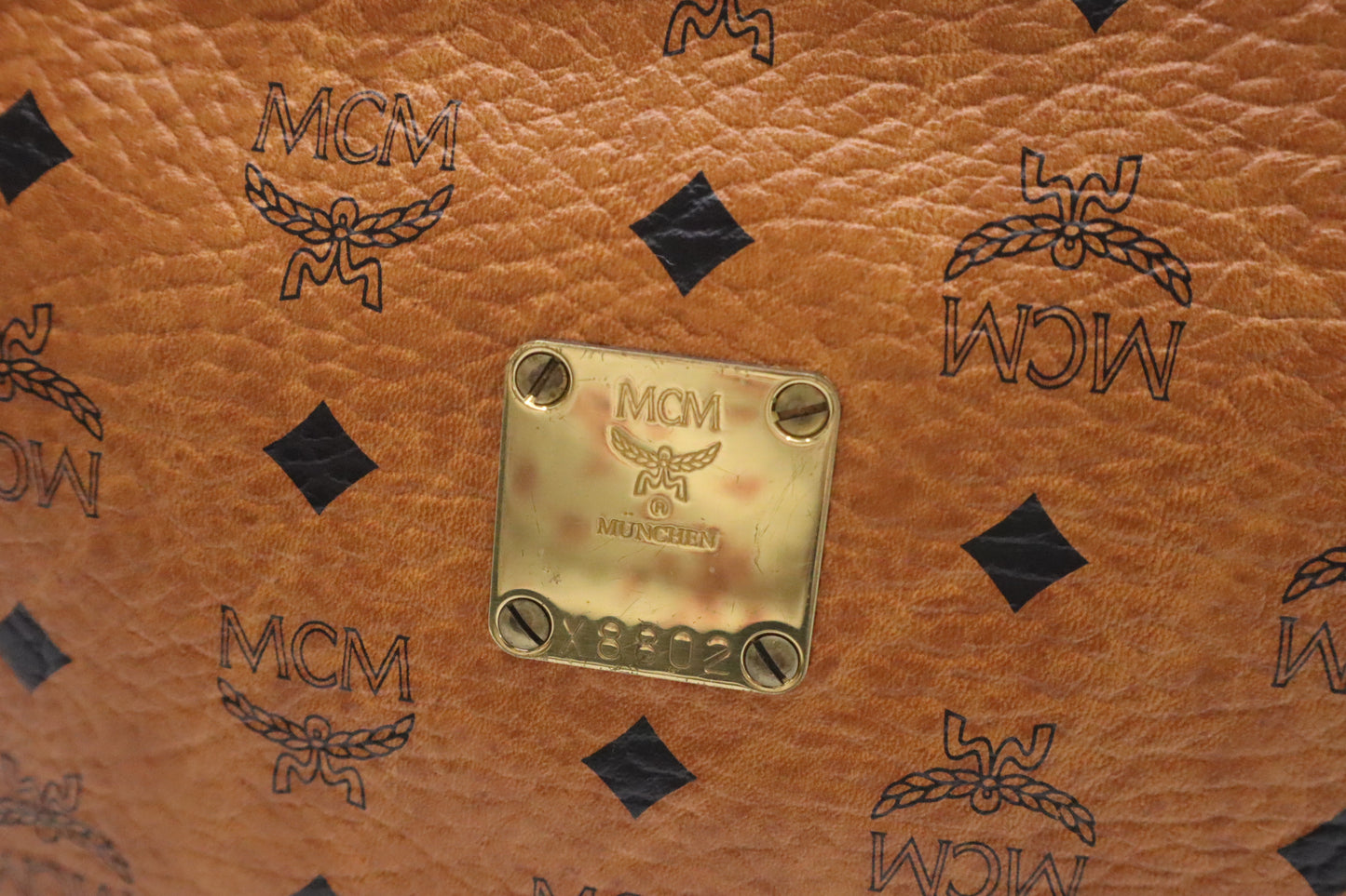 MCM Clutch Bag in Cognac Visetos Coated Canvas