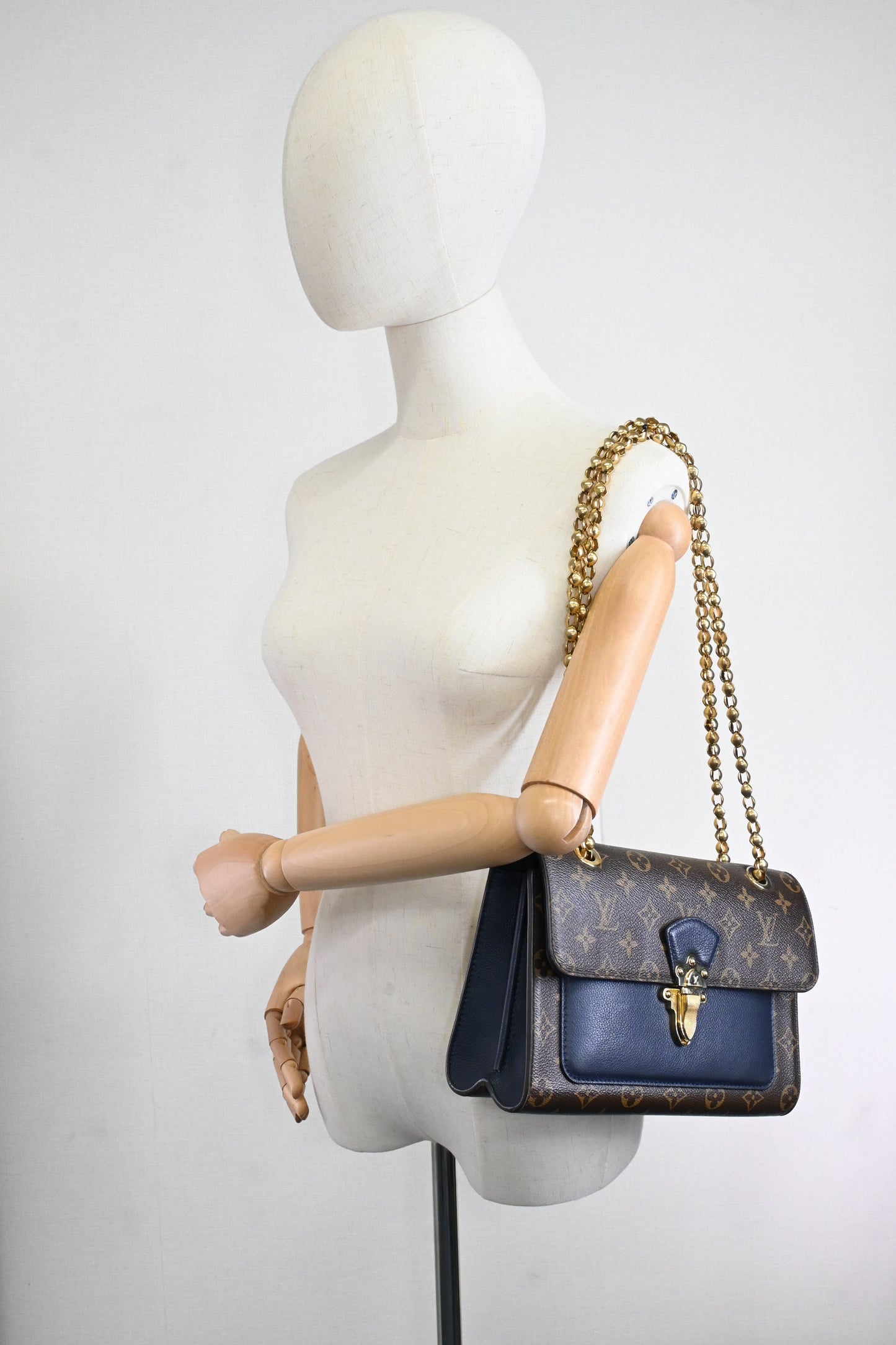 Louis Vuitton Victoire in Monogram Canvas & Blue Leather