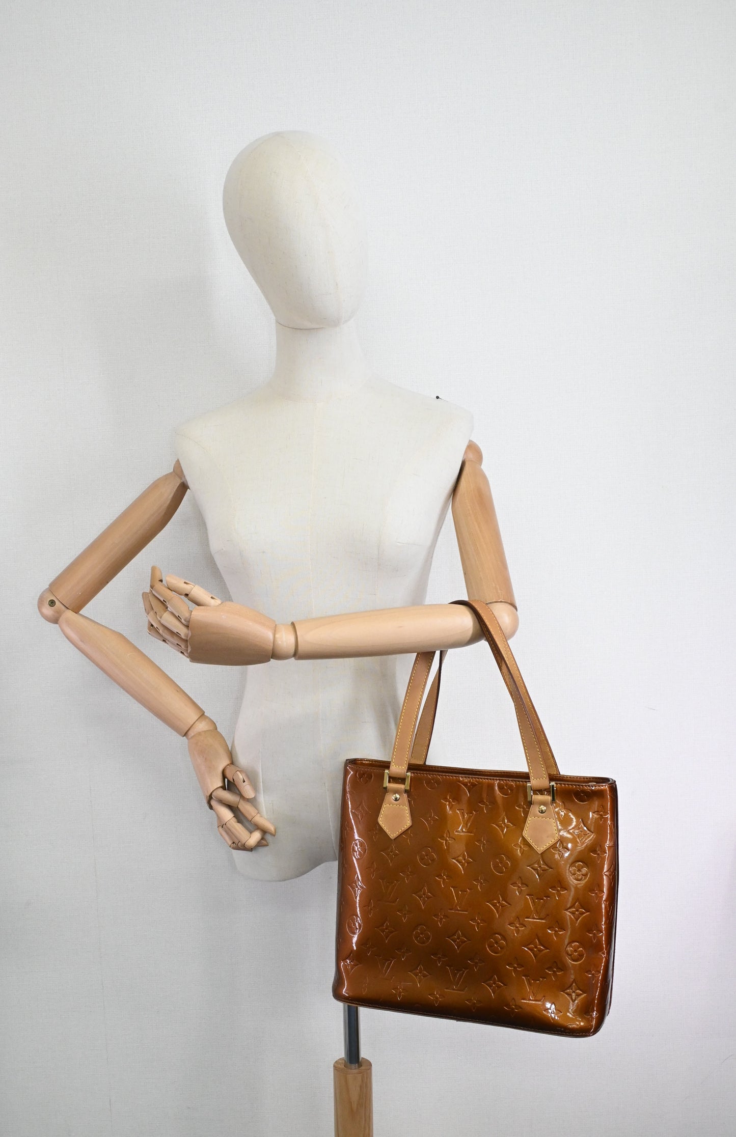 Louis Vuitton Houston in Bronze Vernis Leather