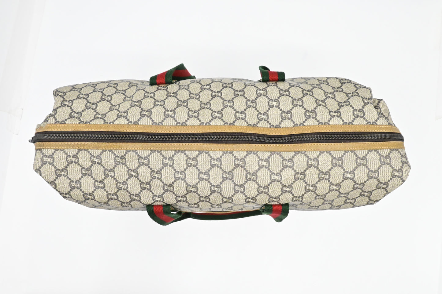 Gucci Plus Zipped Travel Bag in GG Plus Coated Canvas