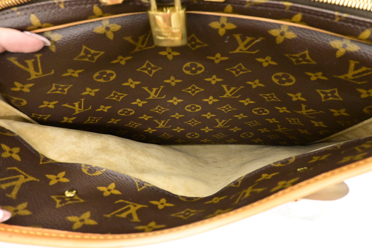 Louis Vuitton Rivoli in Monogram Canvas