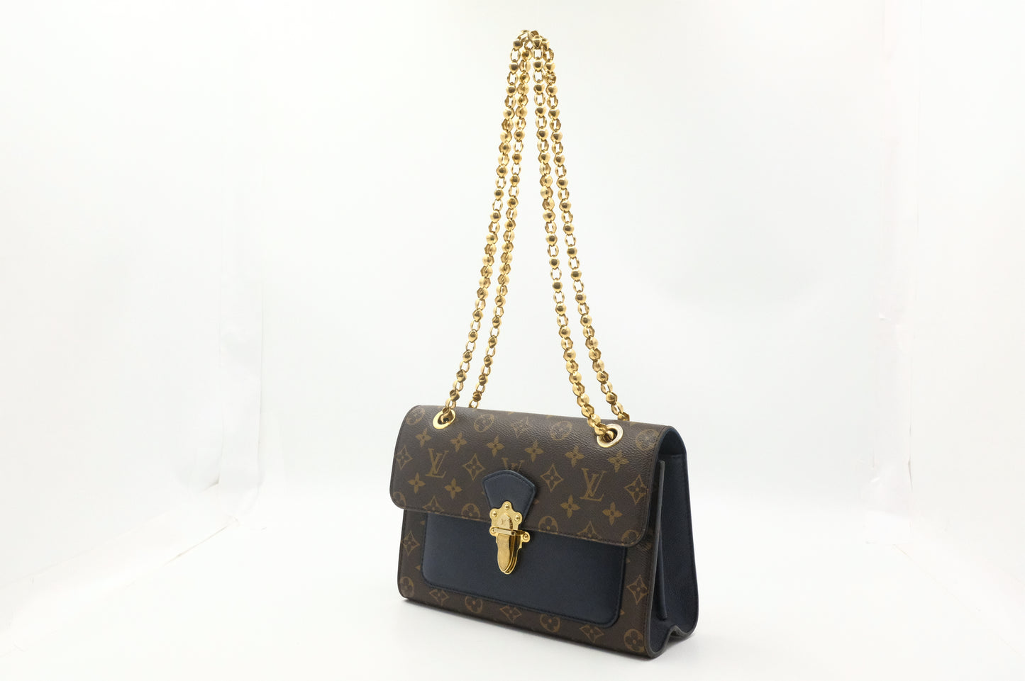 Louis Vuitton Victoire in Monogram Canvas & Blue Leather
