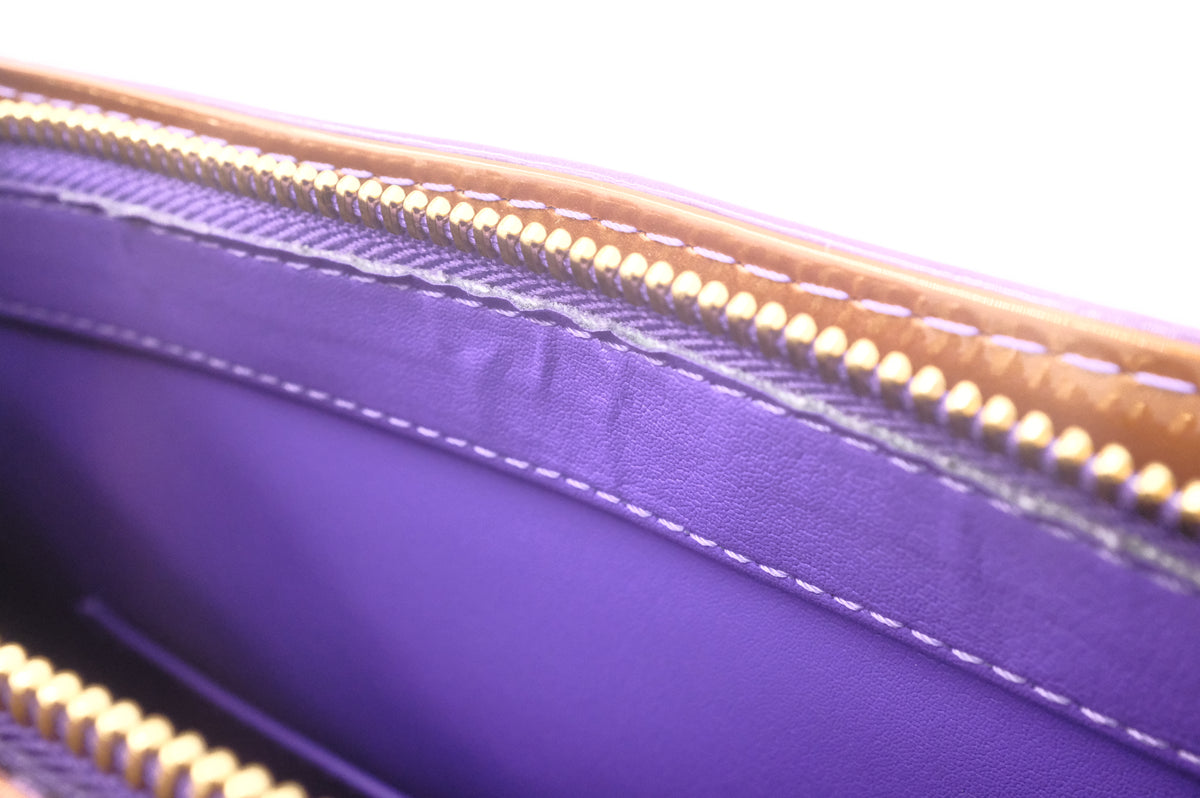 Louis Vuitton Houston in Purple Vernis Leather