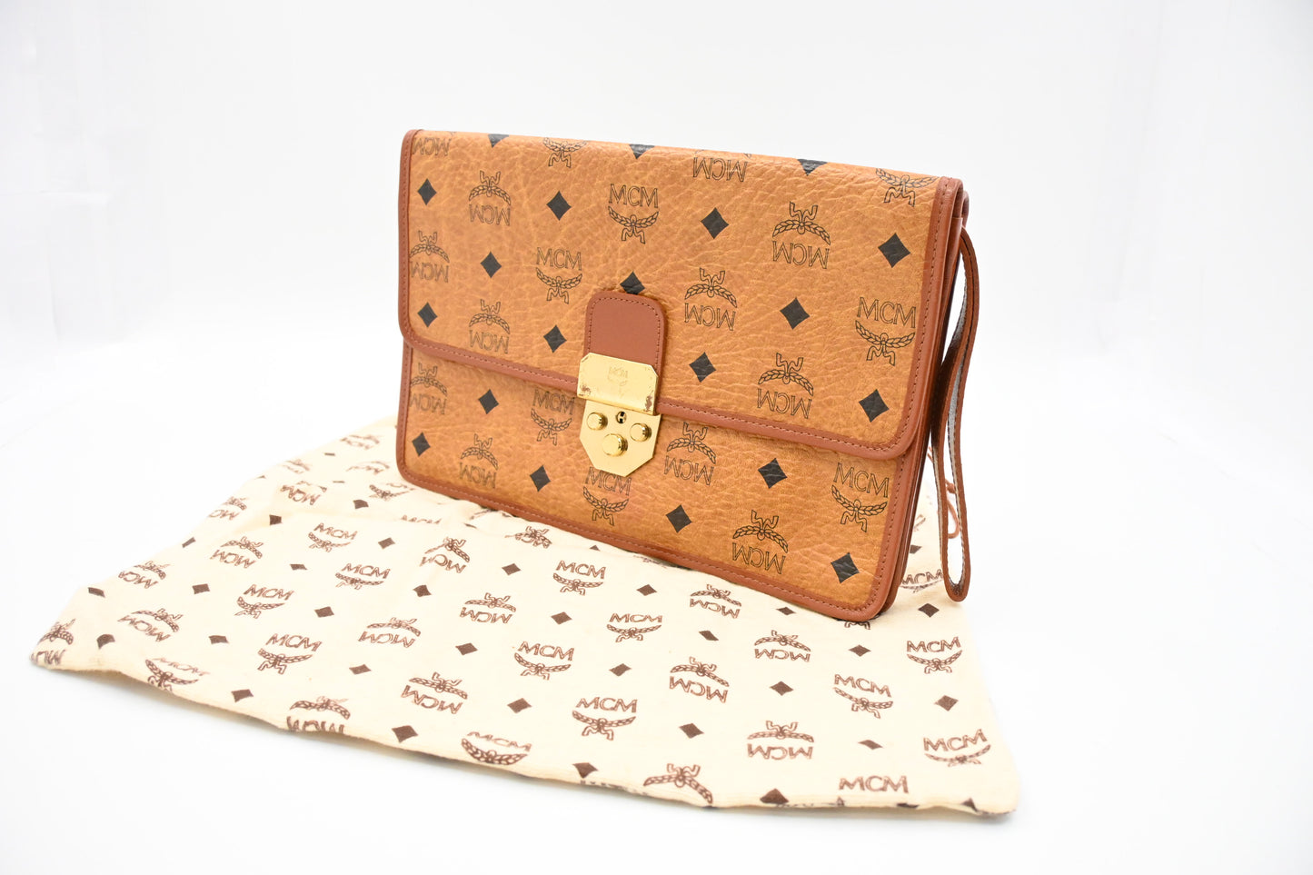 MCM Clutch Bag in Cognac Visetos Canvas