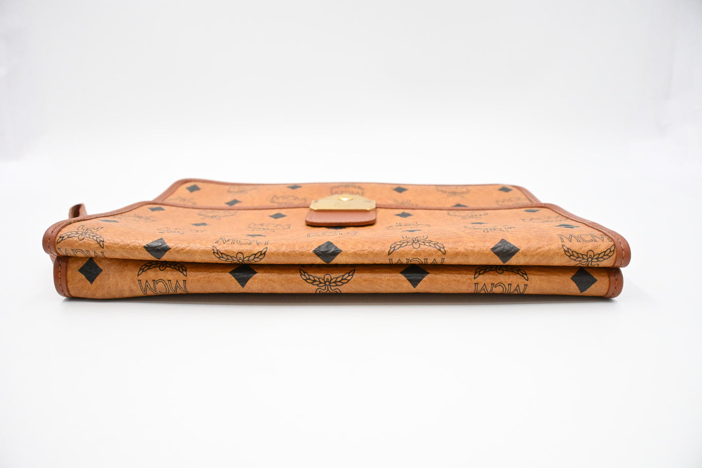 MCM Clutch Bag in Cognac Visetos Canvas