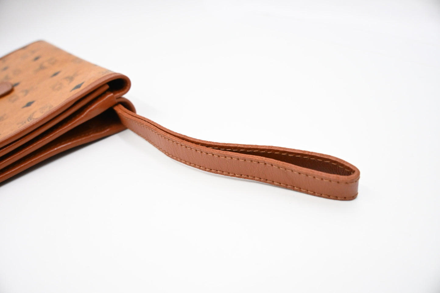 MCM Clutch Bag in Cognac Visetos Canvas