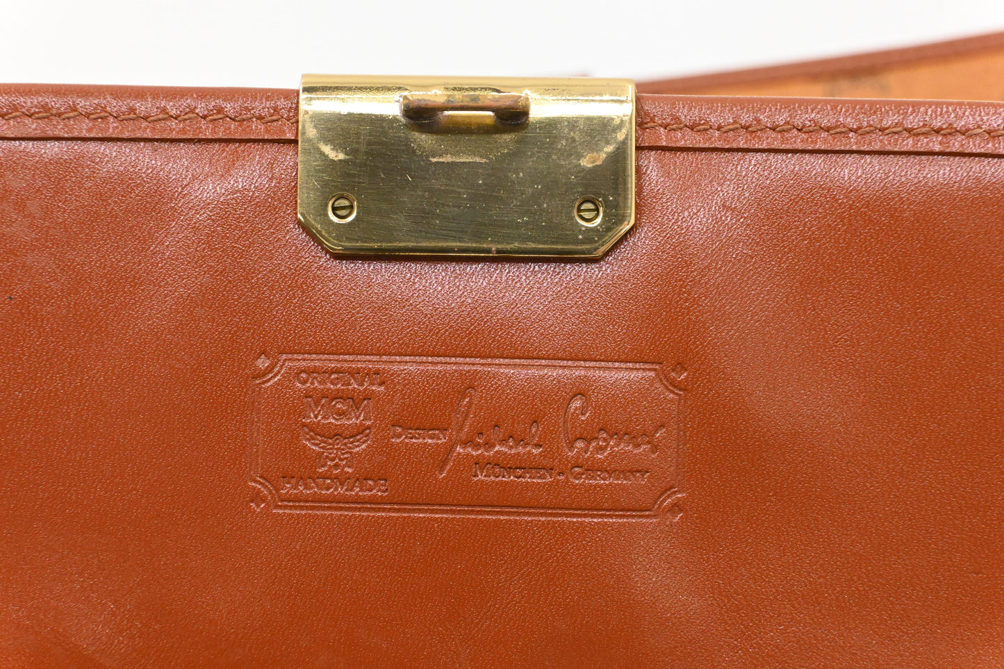 MCM Clutch Bag in Cognac Visetos Canvas