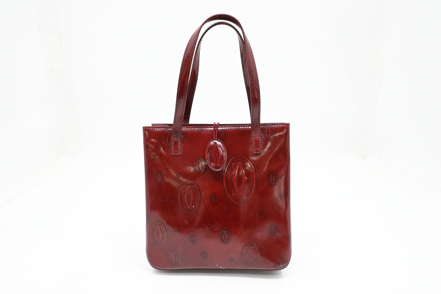 Cartier Handbag in Burgundy Patent Leather