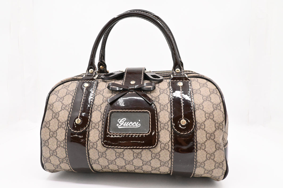 Gucci Boston Bag in GG Supreme Canvas and Brown Patent Leather