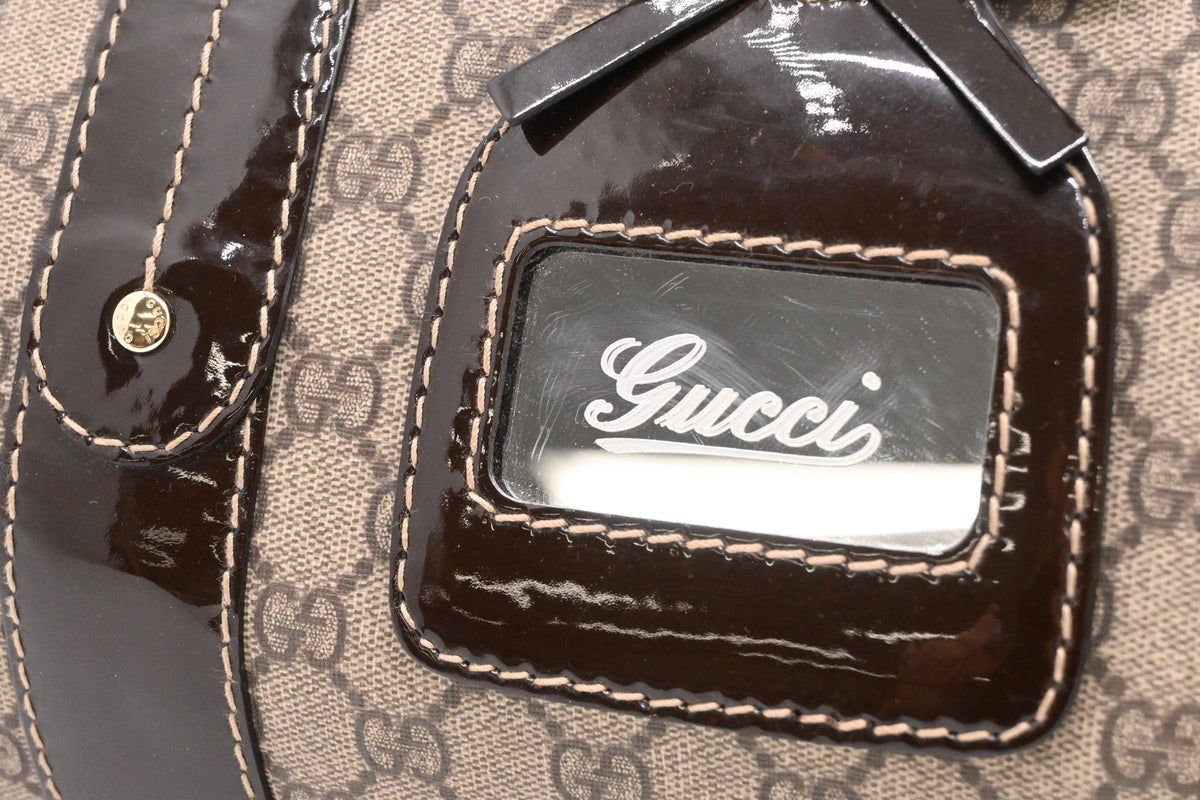 Gucci Boston Bag in GG Supreme Canvas and Brown Patent Leather