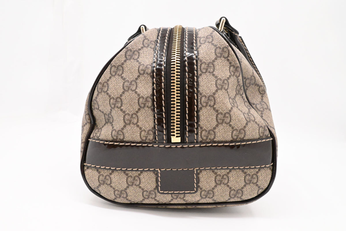 Gucci Boston Bag in GG Supreme Canvas and Brown Patent Leather