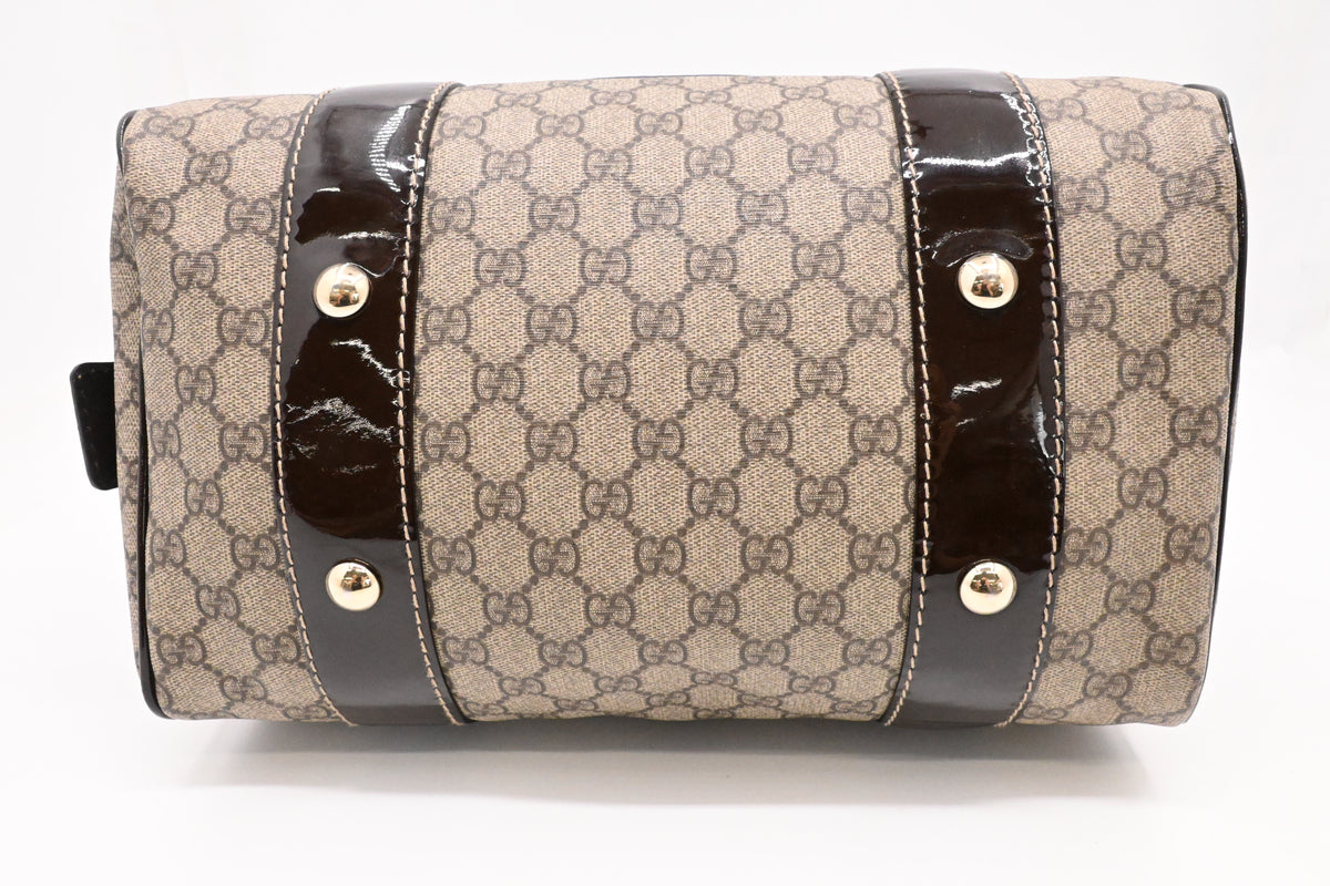 Gucci Boston Bag in GG Supreme Canvas and Brown Patent Leather