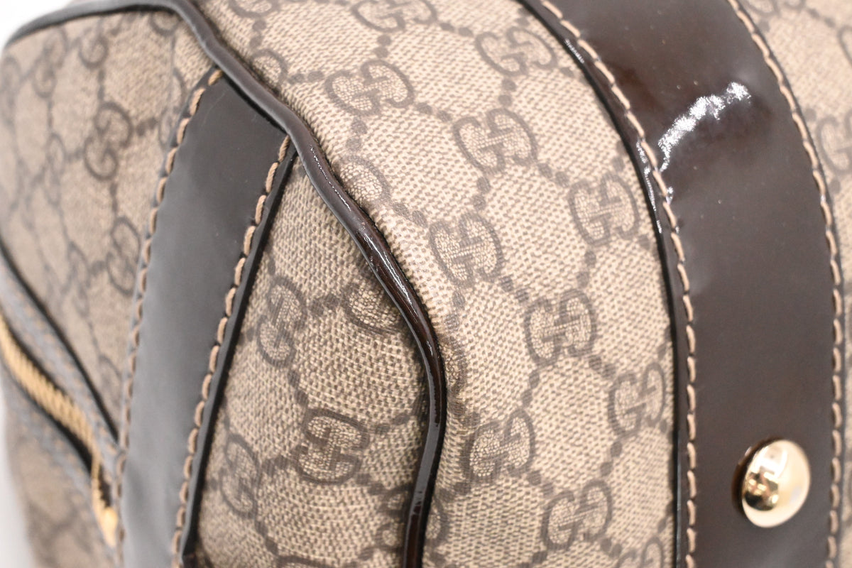Gucci Boston Bag in GG Supreme Canvas and Brown Patent Leather