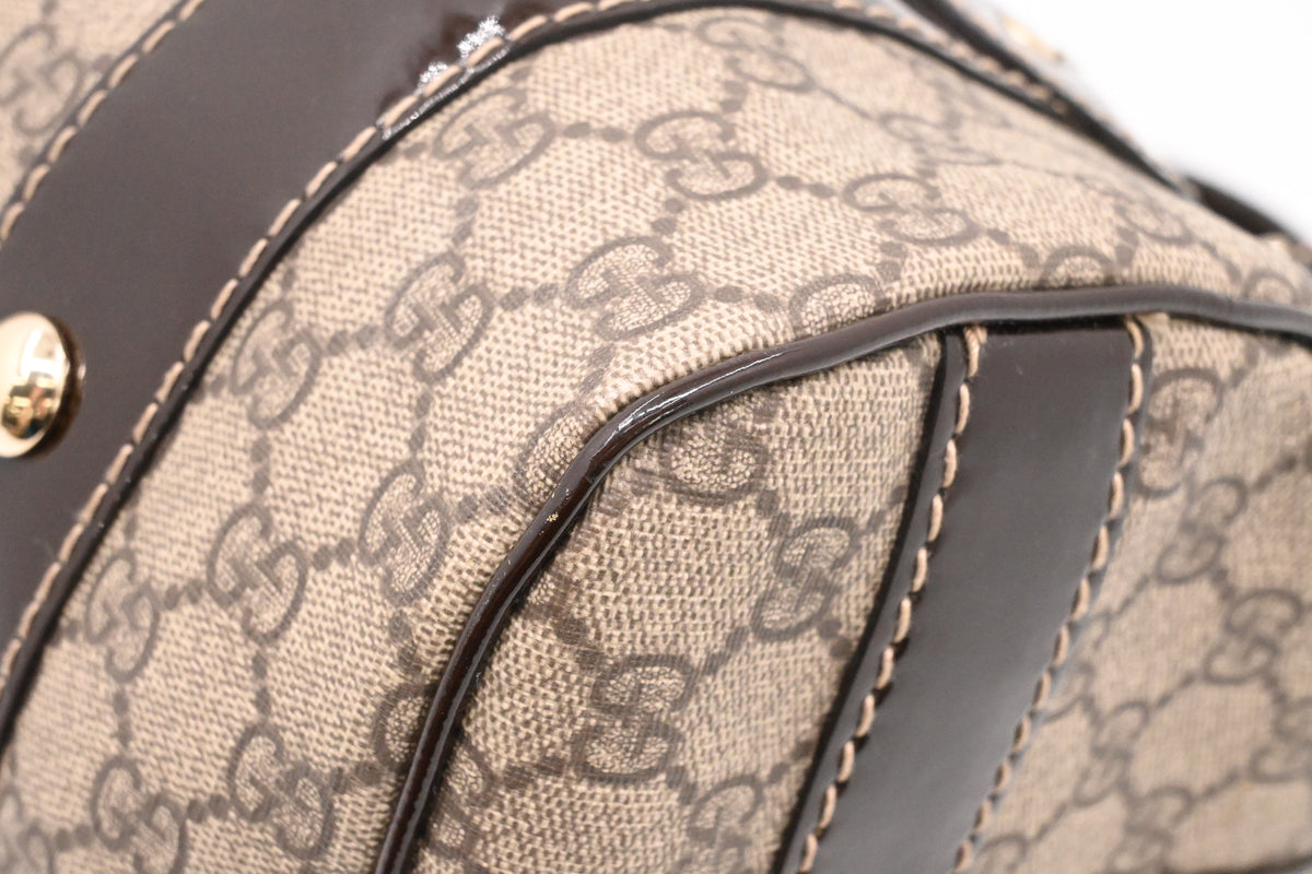 Gucci Boston Bag in GG Supreme Canvas and Brown Patent Leather