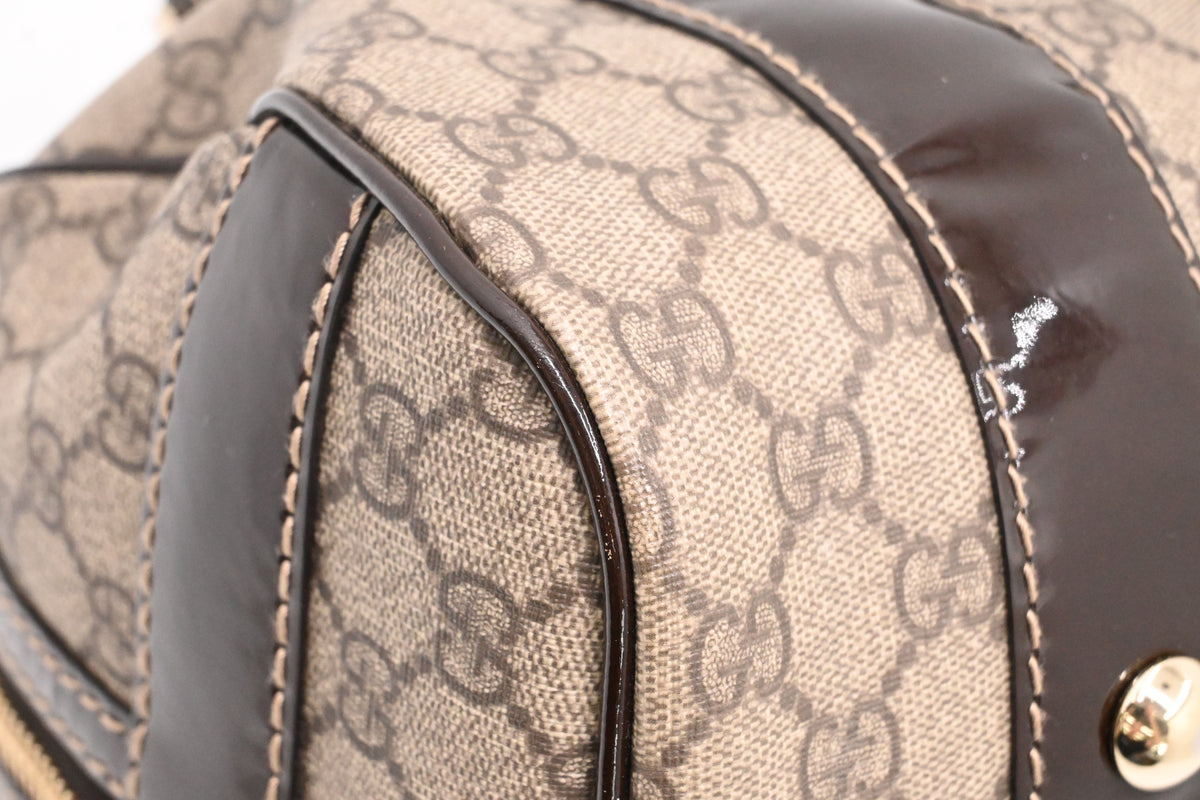 Gucci Boston Bag in GG Supreme Canvas and Brown Patent Leather