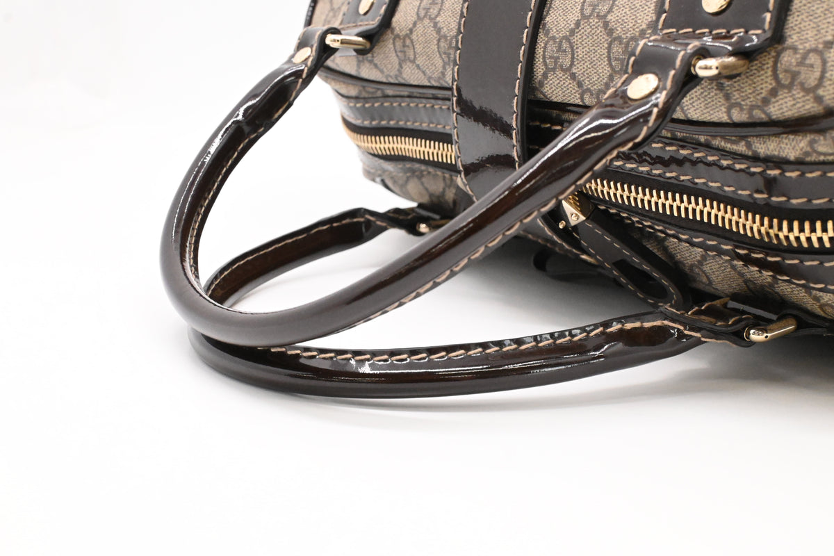 Gucci Boston Bag in GG Supreme Canvas and Brown Patent Leather