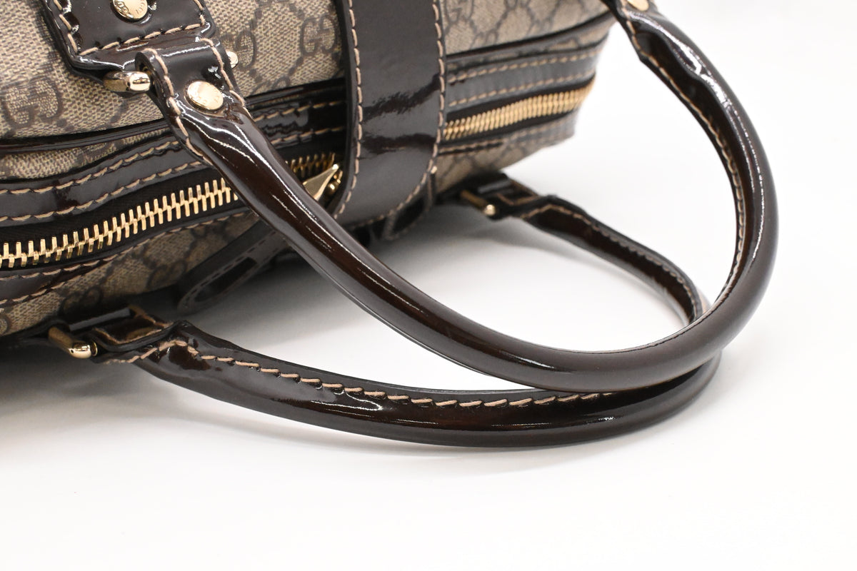 Gucci Boston Bag in GG Supreme Canvas and Brown Patent Leather