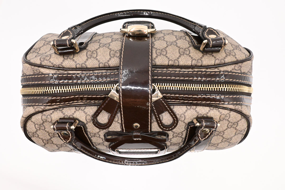 Gucci Boston Bag in GG Supreme Canvas and Brown Patent Leather