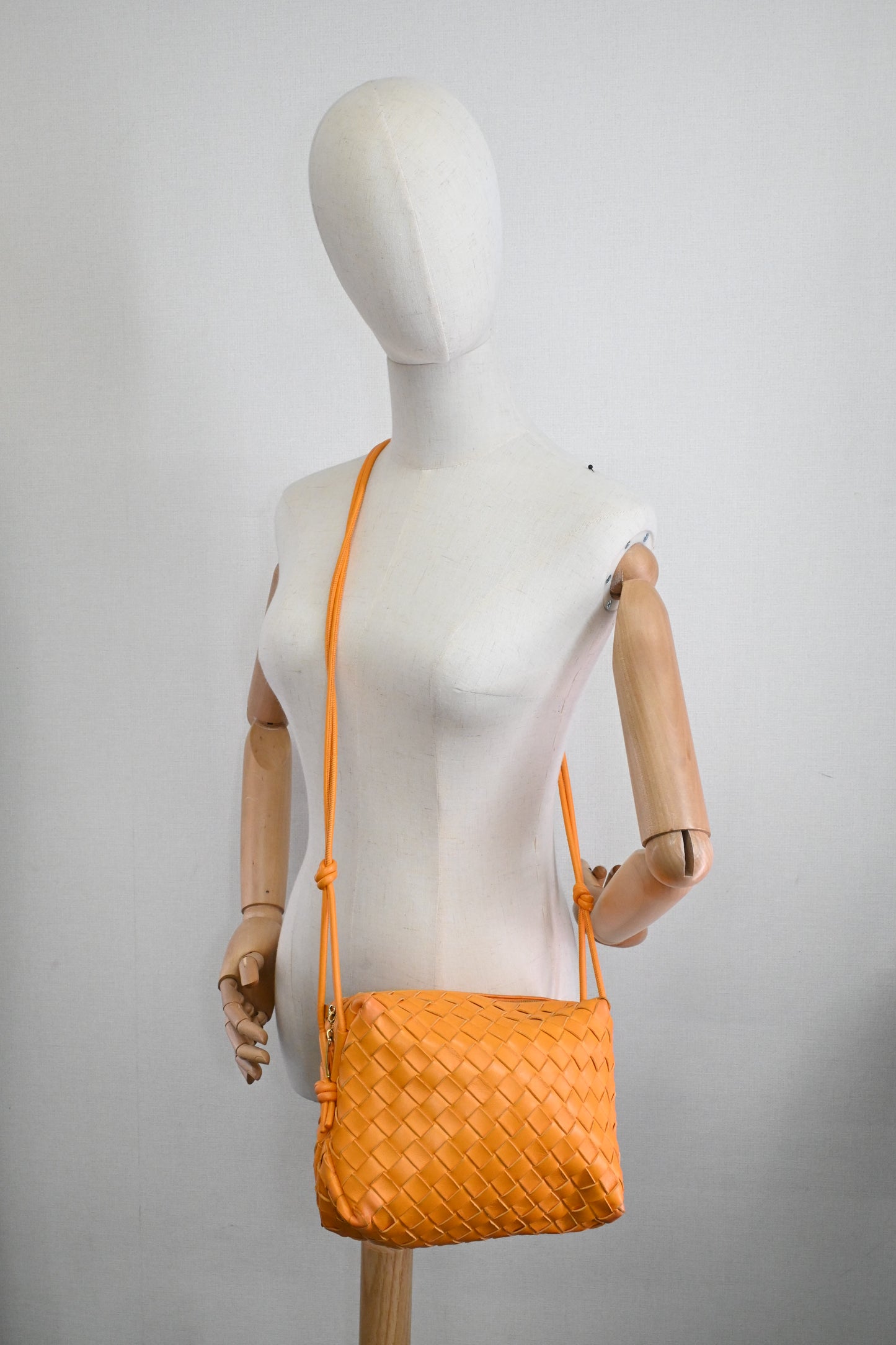 Bottega Veneta Loop Camera Bag in Tangerine Intreciatto Leather