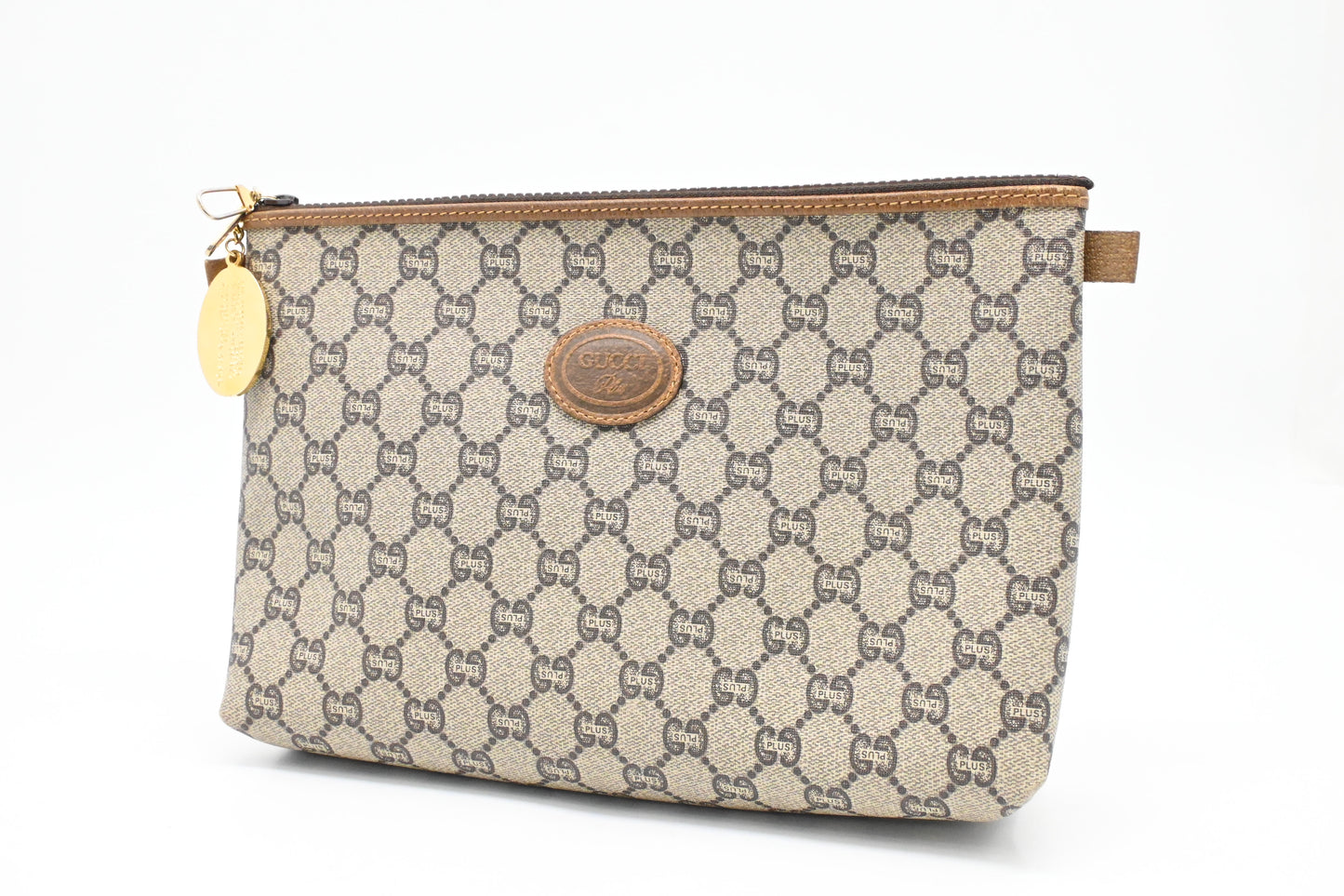 Gucci Plus Clutch in GG Plus Supreme Canvas
