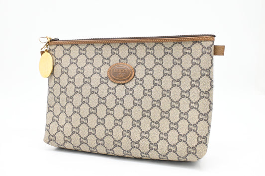 Gucci Plus Clutch in GG Plus Supreme Canvas