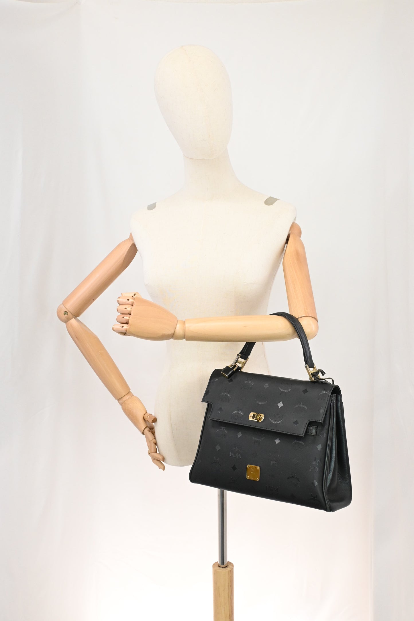 MCM Medium Kelly in Black Coated Canvas