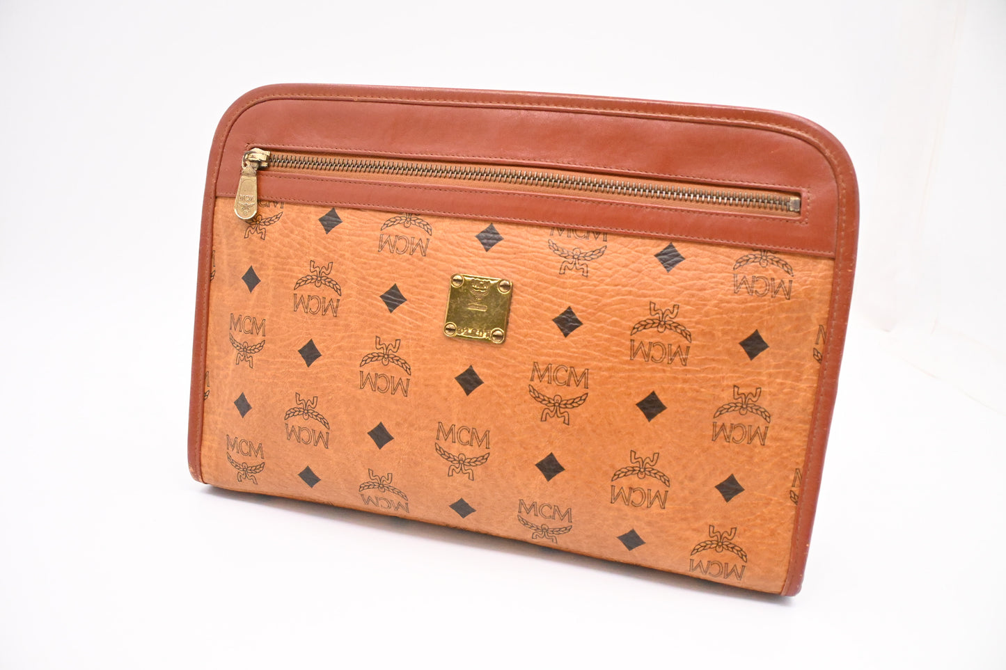 MCM Clutch Bag in Cognac Visetos Canvas