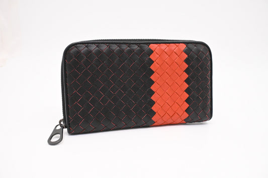 Bottega Veneta Zippy Wallet in Black and Orange Intrecciato Leather