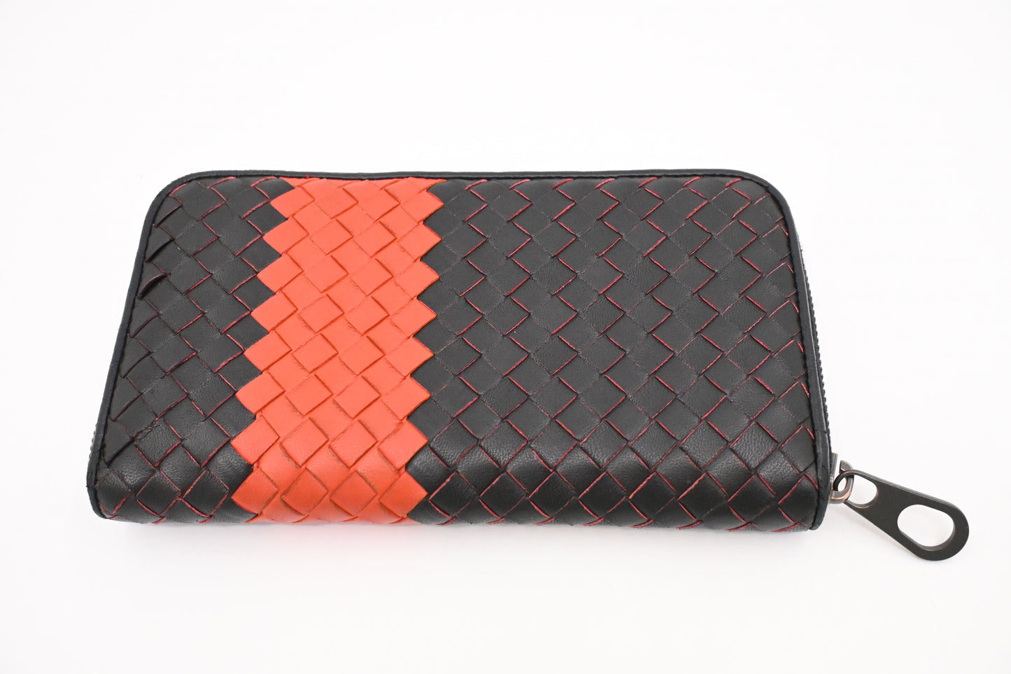 Bottega Veneta Zippy Wallet in Black and Orange Intrecciato Leather
